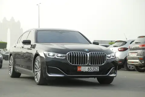 A black BMW 7 Series from the front quarter