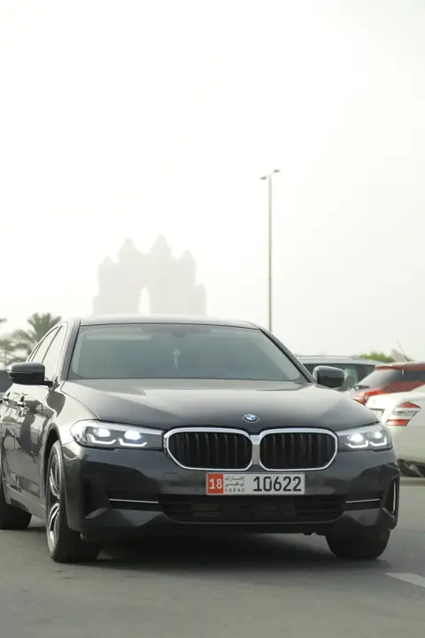 A black BMW sedan head-on
