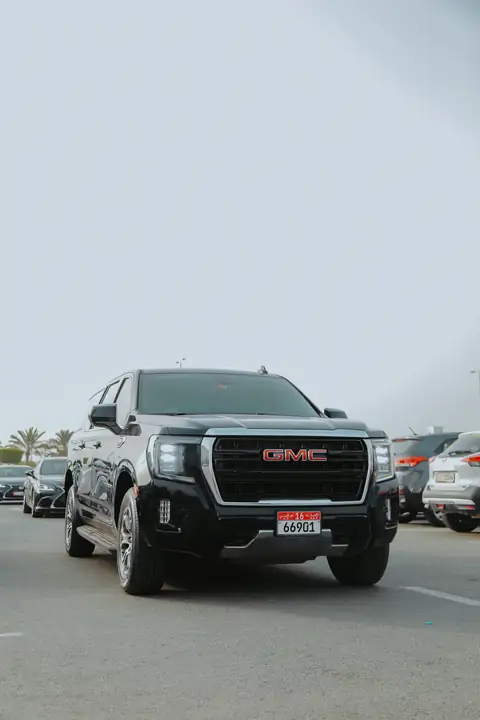 A black GMC Yukon head-on