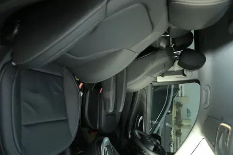 A black leather seat inside a V-Class, close up
