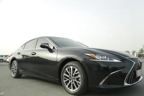 A black Lexus ES from the front quarter