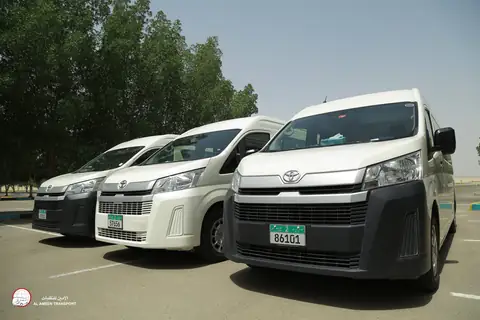 A white van from the front quarter with a second van beside it