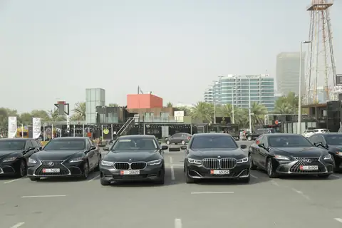 Black sedans in a row, fronts to the camera