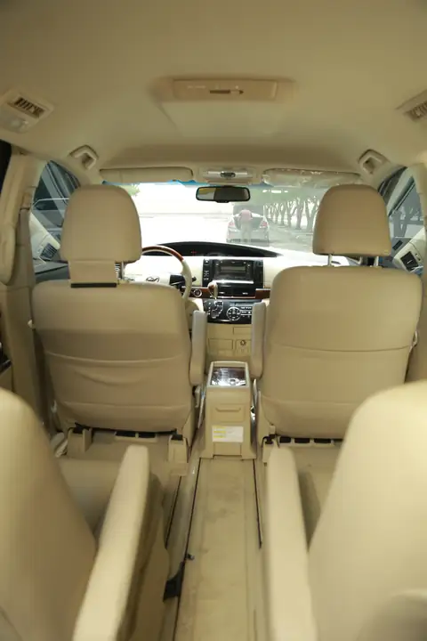 Cream leather seats inside an MPV, seen from above the rear row