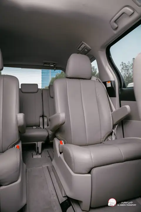 Grey leather seats inside a van, seen from the side door