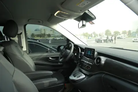 Inside a Mercedes-Benz V-Class: black leather seats and the dashboard