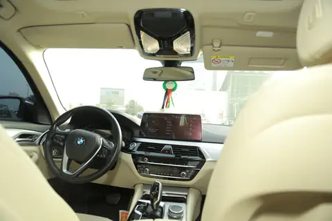 The dashboard and wheel of a BMW sedan
