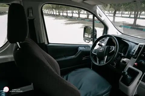 The driving seat and dashboard of a van