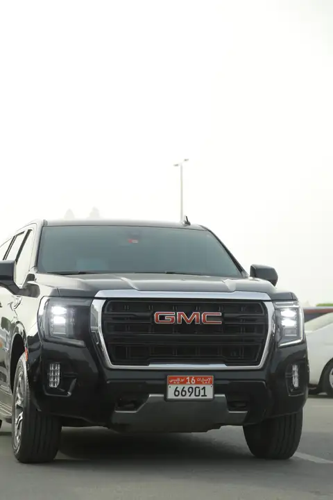 The front of a black GMC Yukon, close up