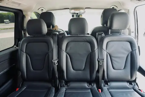The rear cabin of a V-Class with three black leather seats