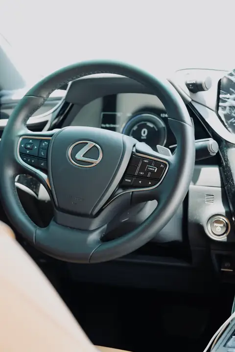 The steering wheel of a Lexus, close up