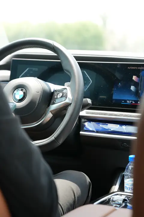 The wheel and screens of a BMW 7 Series from the driving seat