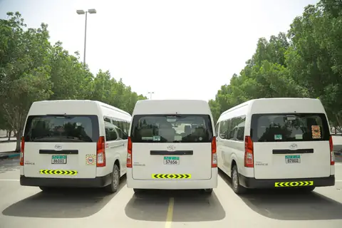 Three white vans from the rear, doors closed