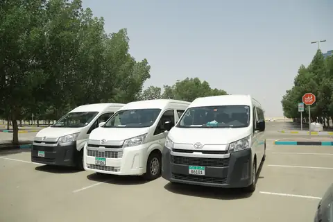 Two white vans from the front quarter in a car park